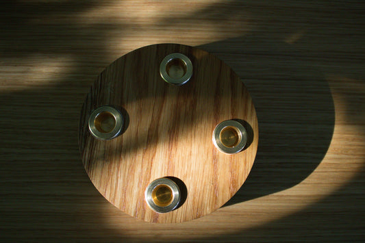 Handmade solid oak candle holder with four brass inserts